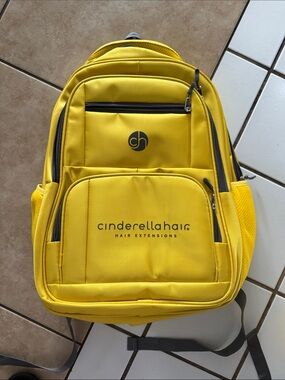 Two Cinderella Hair Yellow Logo Backpacks